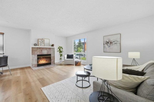 85 Cedarwood Hill Sw, Calgary, AB - Indoor Photo Showing Living Room With Fireplace