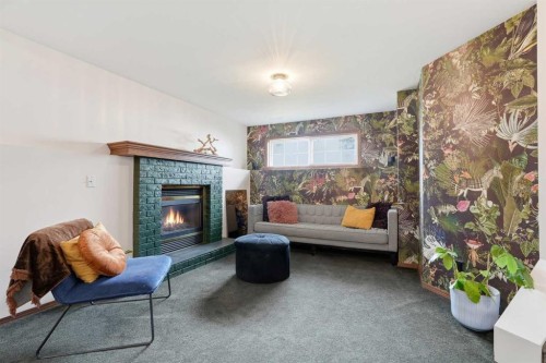 10 Shawbrooke Rise Sw, Calgary, AB - Indoor Photo Showing Living Room With Fireplace