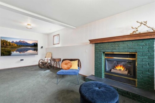 10 Shawbrooke Rise Sw, Calgary, AB - Indoor Photo Showing Living Room With Fireplace