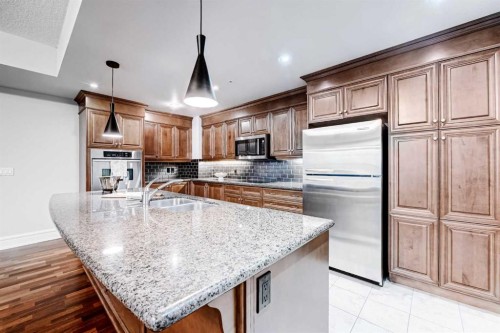 2308-920 5 Avenue Sw, Calgary, AB - Indoor Photo Showing Kitchen With Double Sink