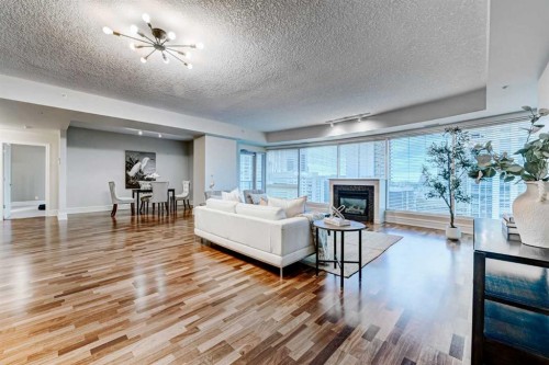2308-920 5 Avenue Sw, Calgary, AB - Indoor Photo Showing Living Room With Fireplace