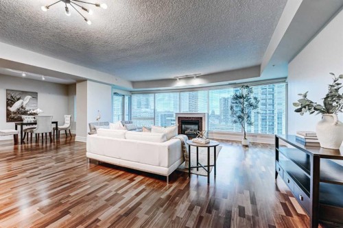 2308-920 5 Avenue Sw, Calgary, AB - Indoor Photo Showing Living Room With Fireplace