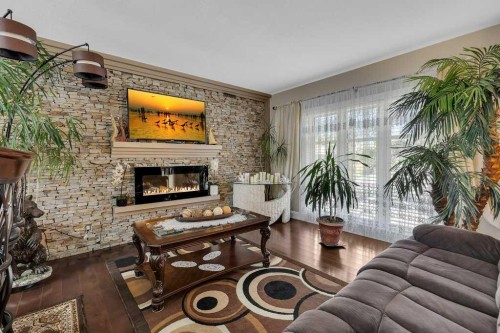 155 Midcrest Crescent Se, Calgary, AB - Indoor Photo Showing Living Room With Fireplace