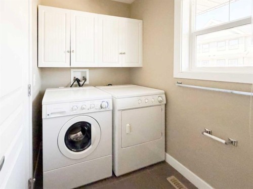 117 Panatella Hill Nw, Calgary, AB - Indoor Photo Showing Laundry Room