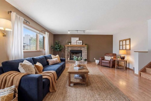 109 Downey Place, Okotoks, AB - Indoor Photo Showing Living Room With Fireplace
