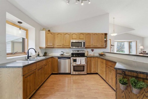 109 Downey Place, Okotoks, AB - Indoor Photo Showing Kitchen With Double Sink