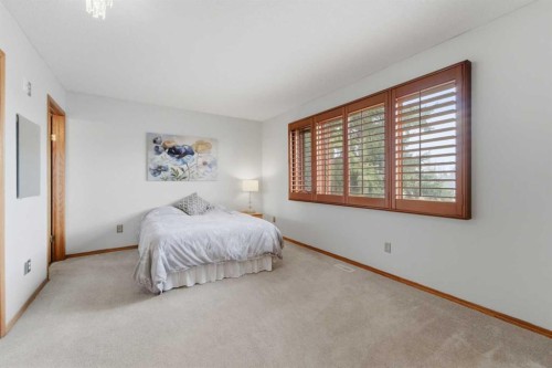109 Downey Place, Okotoks, AB - Indoor Photo Showing Bedroom