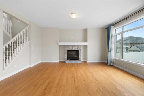 486 Silverado Boulevard Sw, Calgary, AB - Indoor Photo Showing Living Room With Fireplace