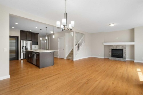 486 Silverado Boulevard Sw, Calgary, AB - Indoor With Fireplace