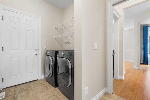 486 Silverado Boulevard Sw, Calgary, AB - Indoor Photo Showing Laundry Room