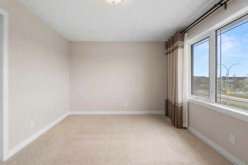 486 Silverado Boulevard Sw, Calgary, AB - Indoor Photo Showing Other Room