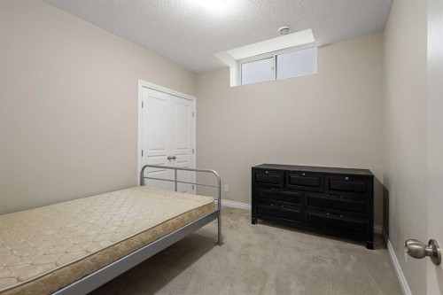 486 Silverado Boulevard Sw, Calgary, AB - Indoor Photo Showing Bedroom