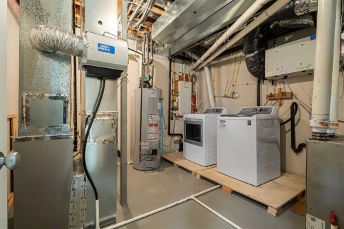 486 Silverado Boulevard Sw, Calgary, AB - Indoor Photo Showing Laundry Room