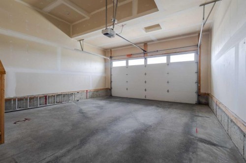 486 Silverado Boulevard Sw, Calgary, AB - Indoor Photo Showing Garage