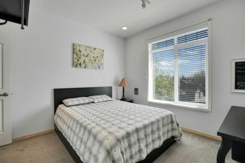 6 Discovery Woods Villas Sw, Calgary, AB - Indoor Photo Showing Bedroom