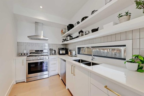 159 Rosery Drive Nw, Calgary, AB - Indoor Photo Showing Kitchen With Double Sink