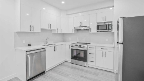 34 Lucas Terrace Nw, Calgary, AB - Indoor Photo Showing Kitchen With Stainless Steel Kitchen With Double Sink With Upgraded Kitchen