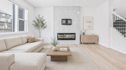 34 Lucas Terrace Nw, Calgary, AB - Indoor Photo Showing Living Room With Fireplace