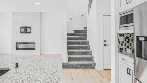 34 Lucas Terrace Nw, Calgary, AB - Indoor With Fireplace