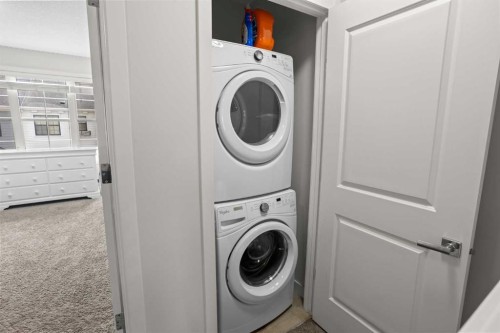 8 Sherwood Row Nw, Calgary, AB - Indoor Photo Showing Laundry Room