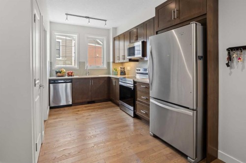 8 Sherwood Row Nw, Calgary, AB - Indoor Photo Showing Kitchen With Stainless Steel Kitchen