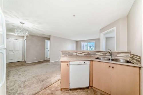 1220-10 Prestwick Bay Se, Calgary, AB - Indoor Photo Showing Kitchen With Double Sink