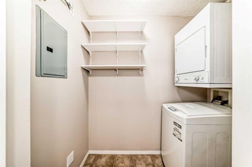 1220-10 Prestwick Bay Se, Calgary, AB - Indoor Photo Showing Laundry Room
