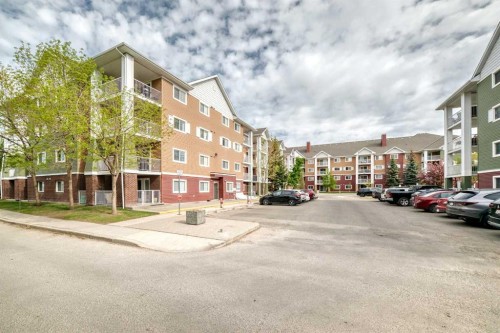 1220-10 Prestwick Bay Se, Calgary, AB - Outdoor With Balcony With Facade