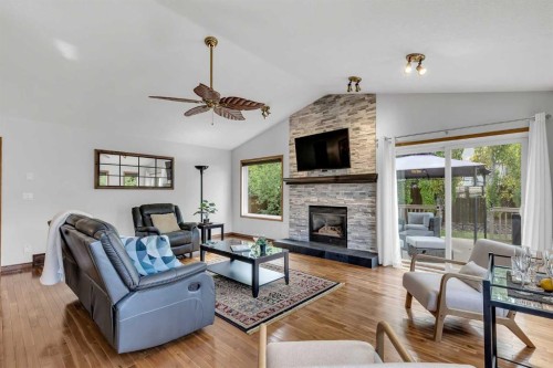 8 Mt Cascade Close Se, Calgary, AB - Indoor Photo Showing Living Room With Fireplace