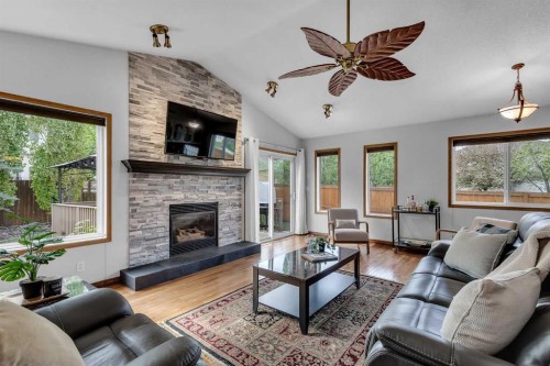 8 Mt Cascade Close Se, Calgary, AB - Indoor Photo Showing Living Room With Fireplace