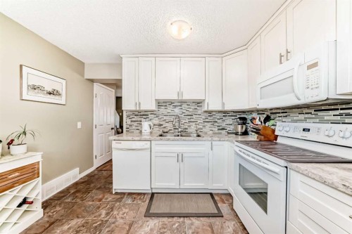 48 Millcrest Way Sw, Calgary, AB - Indoor Photo Showing Kitchen