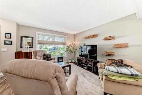 48 Millcrest Way Sw, Calgary, AB - Indoor Photo Showing Living Room