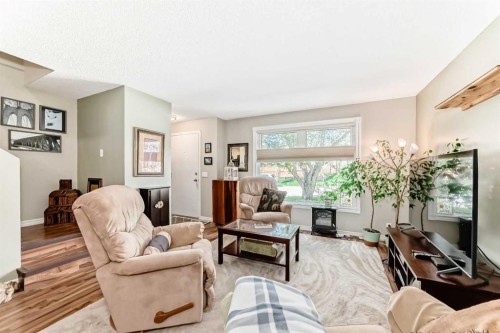 48 Millcrest Way Sw, Calgary, AB - Indoor Photo Showing Living Room