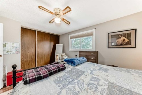 48 Millcrest Way Sw, Calgary, AB - Indoor Photo Showing Bedroom