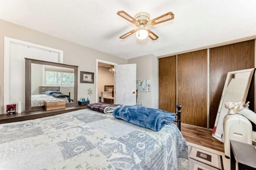 48 Millcrest Way Sw, Calgary, AB - Indoor Photo Showing Bedroom