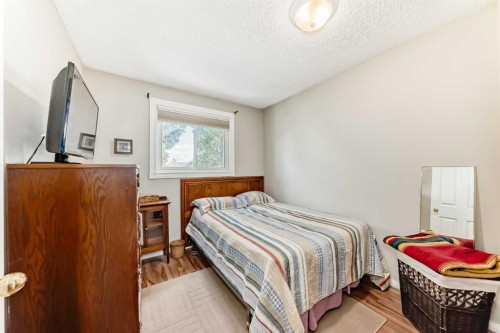 48 Millcrest Way Sw, Calgary, AB - Indoor Photo Showing Bedroom