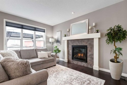 33 Evansglen Drive Nw, Calgary, AB - Indoor Photo Showing Living Room With Fireplace