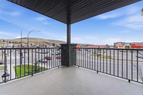 2302-625 Glenbow Drive, Cochrane, AB - Outdoor With Balcony With Exterior