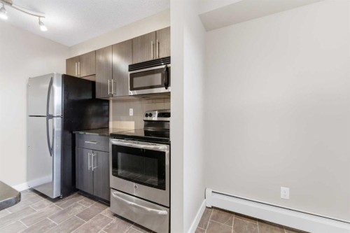 2302-625 Glenbow Drive, Cochrane, AB - Indoor Photo Showing Kitchen With Stainless Steel Kitchen