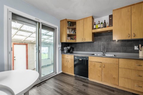 3156 Blakiston Drive Nw, Calgary, AB - Indoor Photo Showing Kitchen With Double Sink