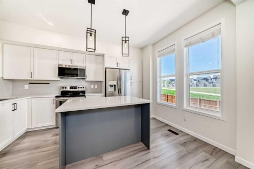 336 South Point Square Sw, Airdrie, AB - Indoor Photo Showing Kitchen With Upgraded Kitchen