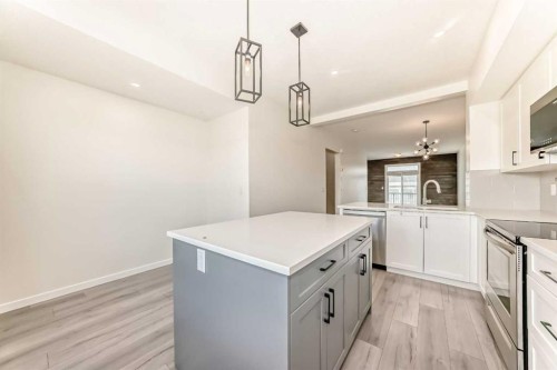 336 South Point Square Sw, Airdrie, AB - Indoor Photo Showing Kitchen With Upgraded Kitchen