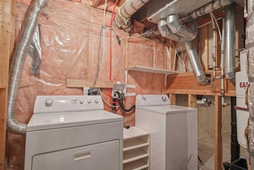 672 Macewan Drive Nw, Calgary, AB - Indoor Photo Showing Laundry Room