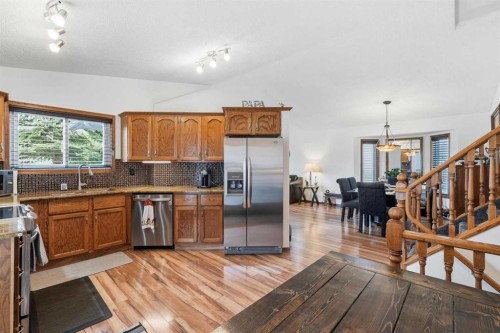 672 Macewan Drive Nw, Calgary, AB - Indoor Photo Showing Kitchen With Stainless Steel Kitchen With Double Sink