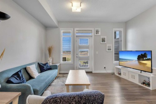 154 Seton Passage Se, Calgary, AB - Indoor Photo Showing Living Room