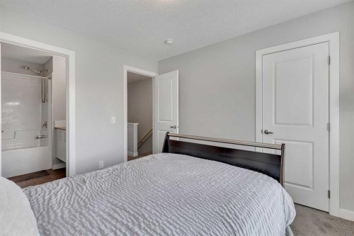 154 Seton Passage Se, Calgary, AB - Indoor Photo Showing Bedroom