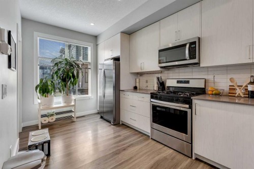 154 Seton Passage Se, Calgary, AB - Indoor Photo Showing Kitchen