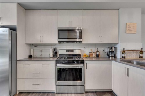 154 Seton Passage Se, Calgary, AB - Indoor Photo Showing Kitchen