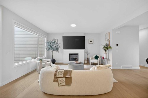 267 Bluerock Avenue Sw, Calgary, AB - Indoor Photo Showing Living Room With Fireplace