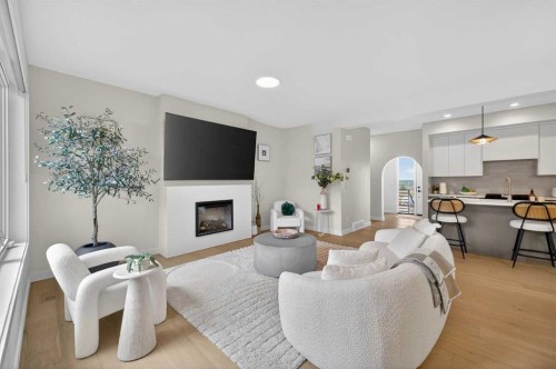 267 Bluerock Avenue Sw, Calgary, AB - Indoor Photo Showing Living Room With Fireplace
